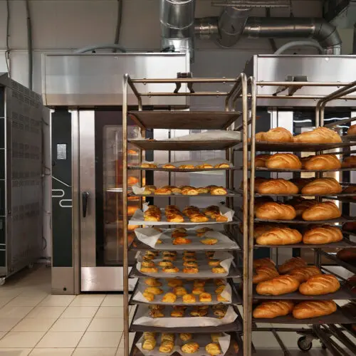 Trolleys of baked goods removed from the oven