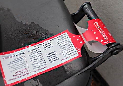 Self-Tie Tags Self-tie tag attached to a bin
