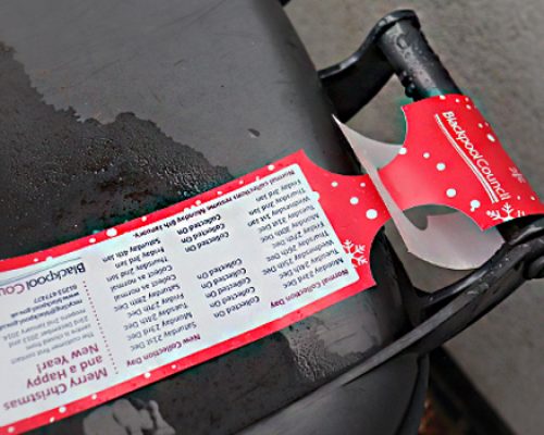 Self-Tie Tags Self-tie tag attached to a bin